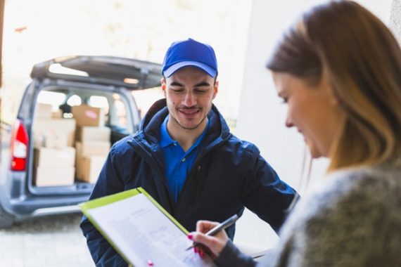 deliveryman-talking-client_23-2147767675